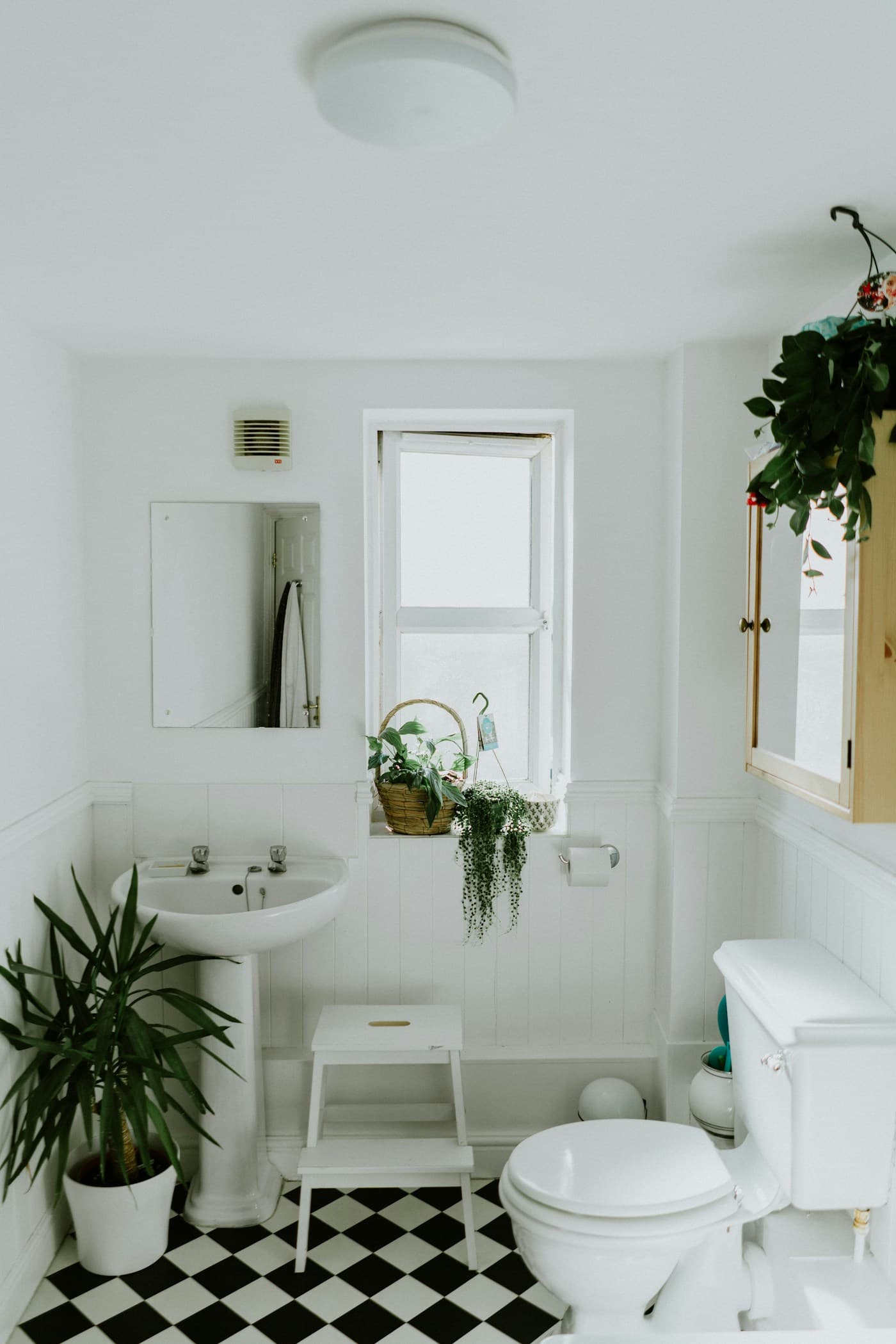 Modern bathroom with large format wall tiles, walk-in shower enclosure and contemporary fittings